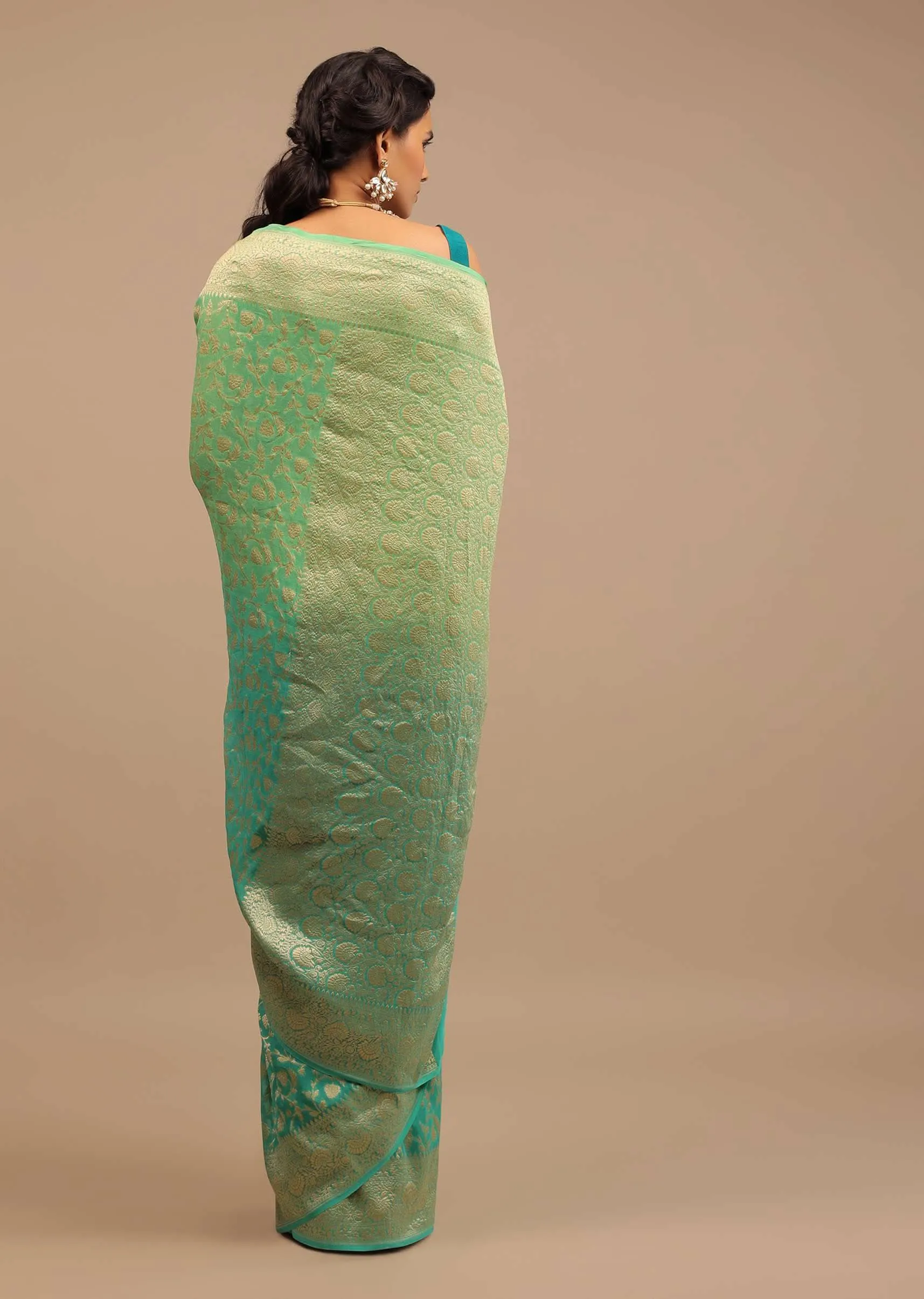 Jade Green Saree Made In Georgette And Beautified With Golden Jaal In A Floral Pattern
