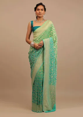 Jade Green Saree Made In Georgette And Beautified With Golden Jaal In A Floral Pattern